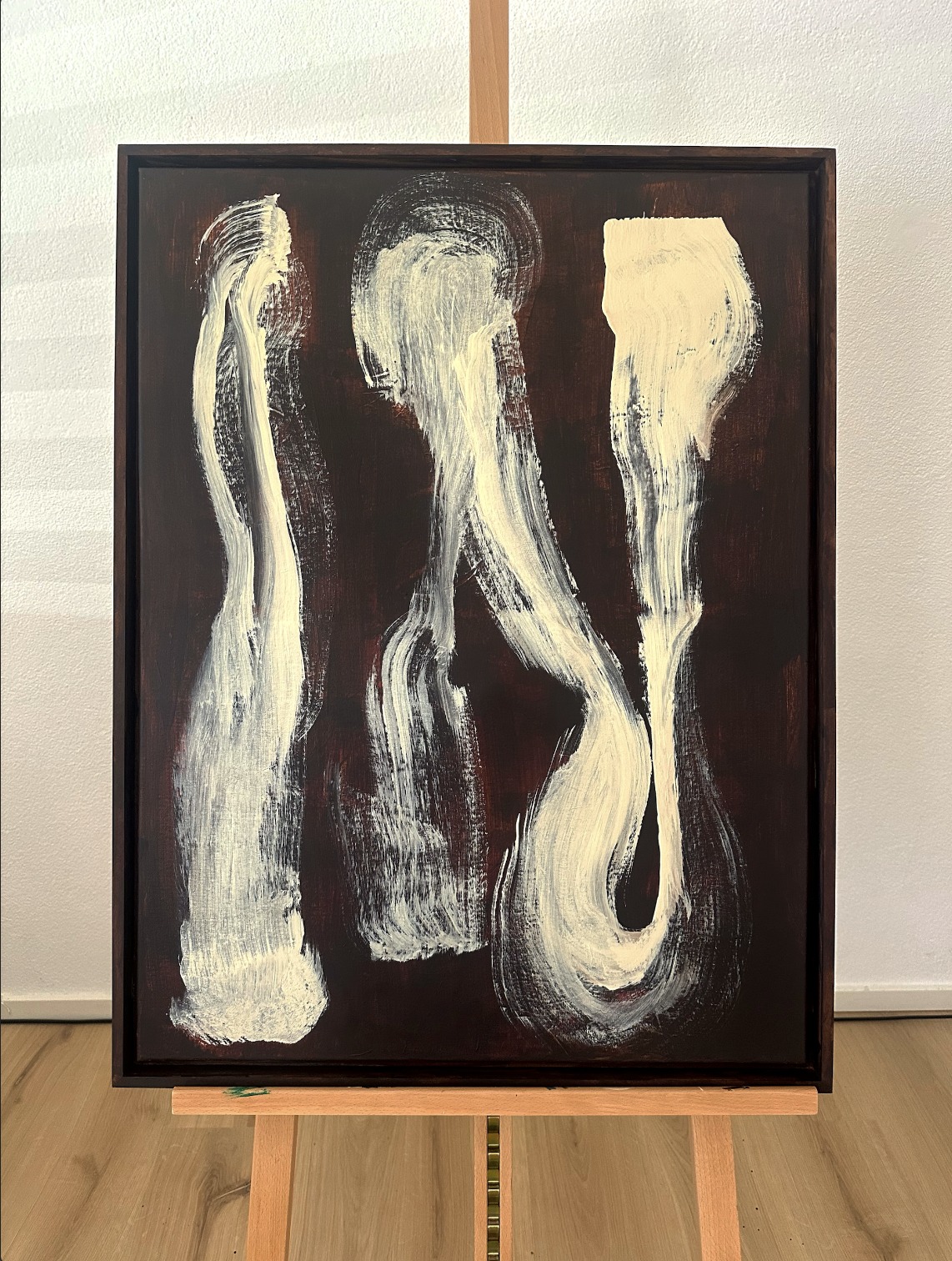 Underneath — full view of the painting on its easel